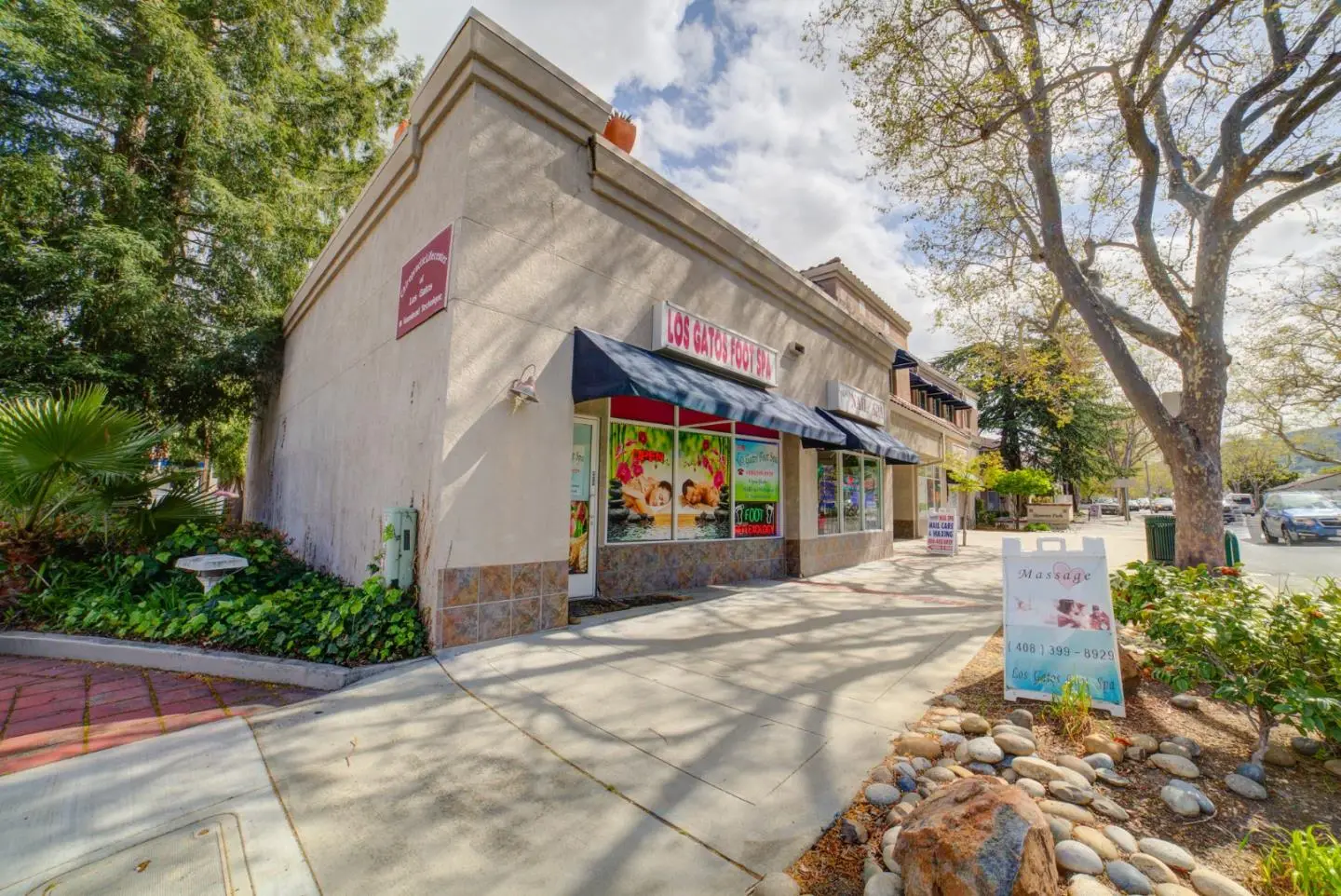 652-656 N Santa Cruz Ave in Los Gatos, a retail building on the corner under sycamore trees