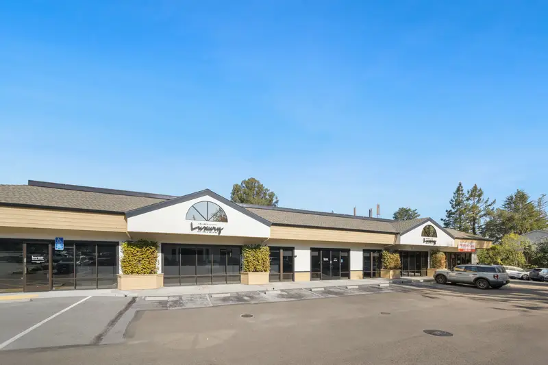 Saratoga Oaks, a single-story building with a gabled entrance and its parking lot